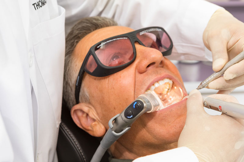 The Isolite 3 in use during a laser procedure with the white light on. Lasers are often used on frenectomies and other dental procedures.