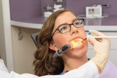 The Isolite 3 in use during a sealant procedure on a female patient.