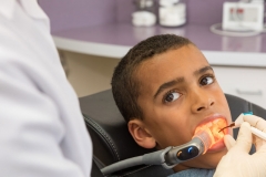 The Isolite 3 in use during a sealant procedure on a male patient.